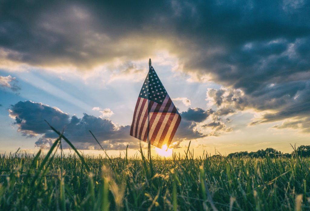 celebrating veterns day with flag in field at sunset Heat Press Machine - Insta Graphic Systems